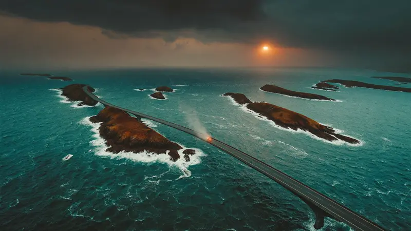 Aerial view of the Atlantic Ocean Road curving between islets in stormy light
